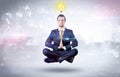 Businessman meditates with enlightenment concept Royalty Free Stock Photo