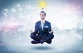 Businessman meditates with enlightenment concept Royalty Free Stock Photo