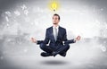 Businessman meditates with enlightenment concept Royalty Free Stock Photo