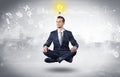Businessman meditates with enlightenment concept Royalty Free Stock Photo
