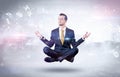 Businessman meditates with enlightenment concept Royalty Free Stock Photo