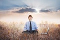 Businessman meditating in lotus pose