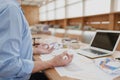 Businessman meditating in office doing yoga in lotus pose Royalty Free Stock Photo