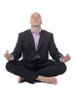 Businessman meditating in yoga lotus