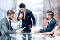 Businessman with a megaphone at a meeting with the business team Royalty Free Stock Photo