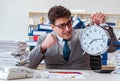 The businessman missing deadlines due to excessive work