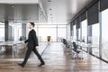 Businessman in modern concrete office interior Royalty Free Stock Photo