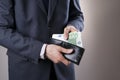 Businessman with money in purse in hands Royalty Free Stock Photo