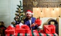 Businessman near christmas tree wrapping presents or gift boxes. Which is for me. Ready with gifts. Lets celebrate new Royalty Free Stock Photo