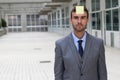 Businessman with a note on his forehead Royalty Free Stock Photo