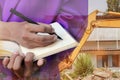 Businessman with notepad in hand signing documents in constru