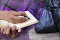 Businessman with notepad hand signing rid in industry garbage bag black double exposure concept Royalty Free Stock Photo