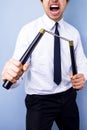 Businessman with nunchaku nunchucks