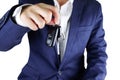 Businessman offering a car key,Close up of hand showing key of a Royalty Free Stock Photo