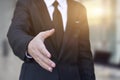 Businessman offering his hand for handshake Royalty Free Stock Photo