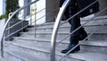 Businessman on office building stairs, end of work day, urban lifestyle, work