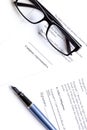 Businessman office desk with contract for signig, glasses and pen top view Royalty Free Stock Photo