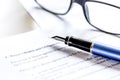 Businessman office desk with contract for signig, glasses and pen Royalty Free Stock Photo