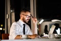 Businessman in the office at night working late. Royalty Free Stock Photo