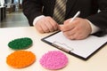 Businessman in the office signs a contract for the supply of plastic granules for industry. Plastic raw material in granules