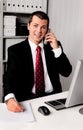 Businessman in office with telephone Royalty Free Stock Photo