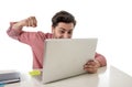 Businessman at office working stressed on computer laptop overworked throwing punch in work stress Royalty Free Stock Photo