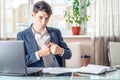 Businessman official sitting in the office hides a bribe unnoticed in his pocket. Corruption and bribery Royalty Free Stock Photo