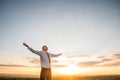 Businessman with Open Arms at the Field on sunset Royalty Free Stock Photo