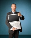 Businessman with open laptop shows welldone