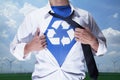 Businessman with open short revealing shirt with recycling symbol underneath Royalty Free Stock Photo