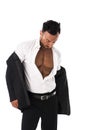 Businessman opening his shirt revealing muscular torso