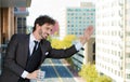 Businessman outdoors, apartment balcony Royalty Free Stock Photo