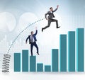 Businessman outperforming his competition jumping over Royalty Free Stock Photo