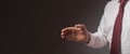 Businessman outsretched his hand for handshake over black background. Cropped man in white shirt and tie. Banner with Royalty Free Stock Photo