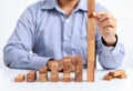 Businessman and outstanding wooden toy block