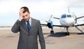 Businessman over airplane on runway background Royalty Free Stock Photo