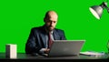 Businessman over greenscreen feeling tired and stressed