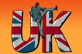 Businessman overcomes the border. UK word flag