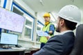 Businessman Overseeing Plant Production