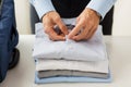 Businessman packing clothes into travel bag Royalty Free Stock Photo