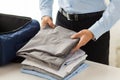 Businessman packing clothes into travel bag Royalty Free Stock Photo