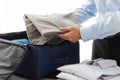 Businessman packing clothes into travel bag Royalty Free Stock Photo