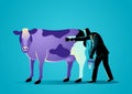 Businessman painting a cow with puple paint
