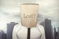 Businessman with a paper bag on head with lost