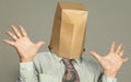 Businessman with a paper bag on his head