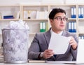 Businessman in paper recycling concept in office Royalty Free Stock Photo