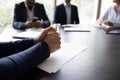 Businessman participates in meeting, put his hands on table closeup