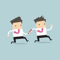 Businessman passing baton to the other in relay race Royalty Free Stock Photo