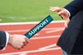 Businessman passing relay baton to another business person support help concept Royalty Free Stock Photo