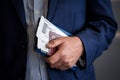 Businessman with passport and boarding pass at the airport Royalty Free Stock Photo